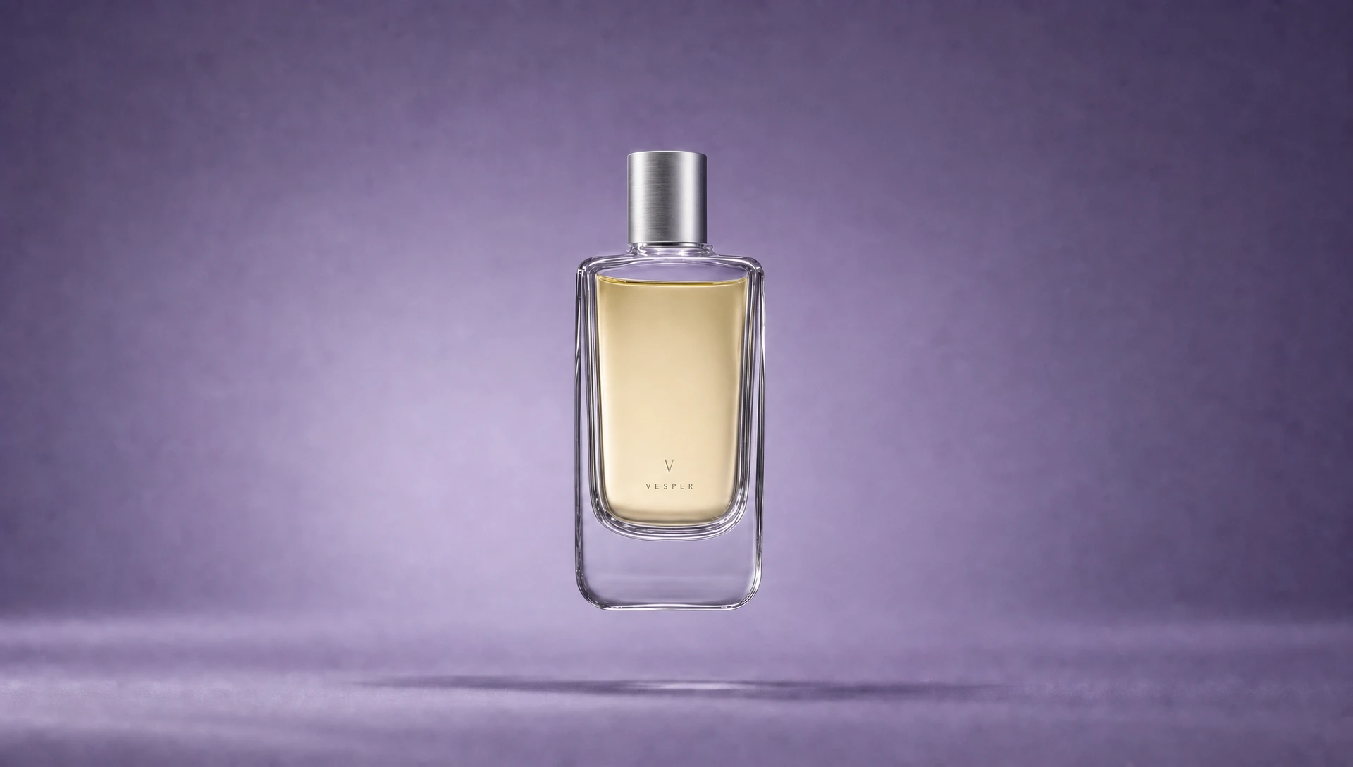 Finished Vesper perfume bottle with pale golden liquid and a brushed silver cap